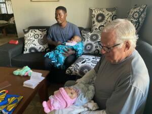 ron and ibrahim holding babies
